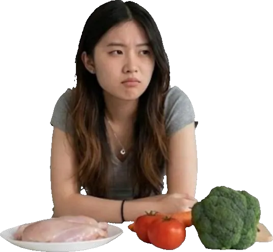 Person staring at raw ingredients, unsure what to cook