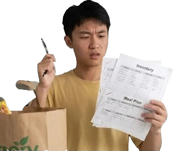Person juggling groceries and a paper inventory list